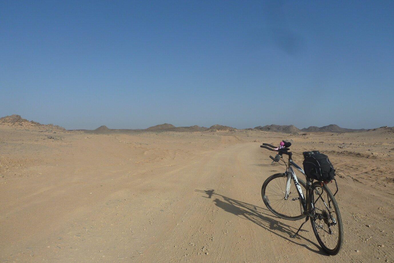 A picture of my bicycle on a dusty road in africa
