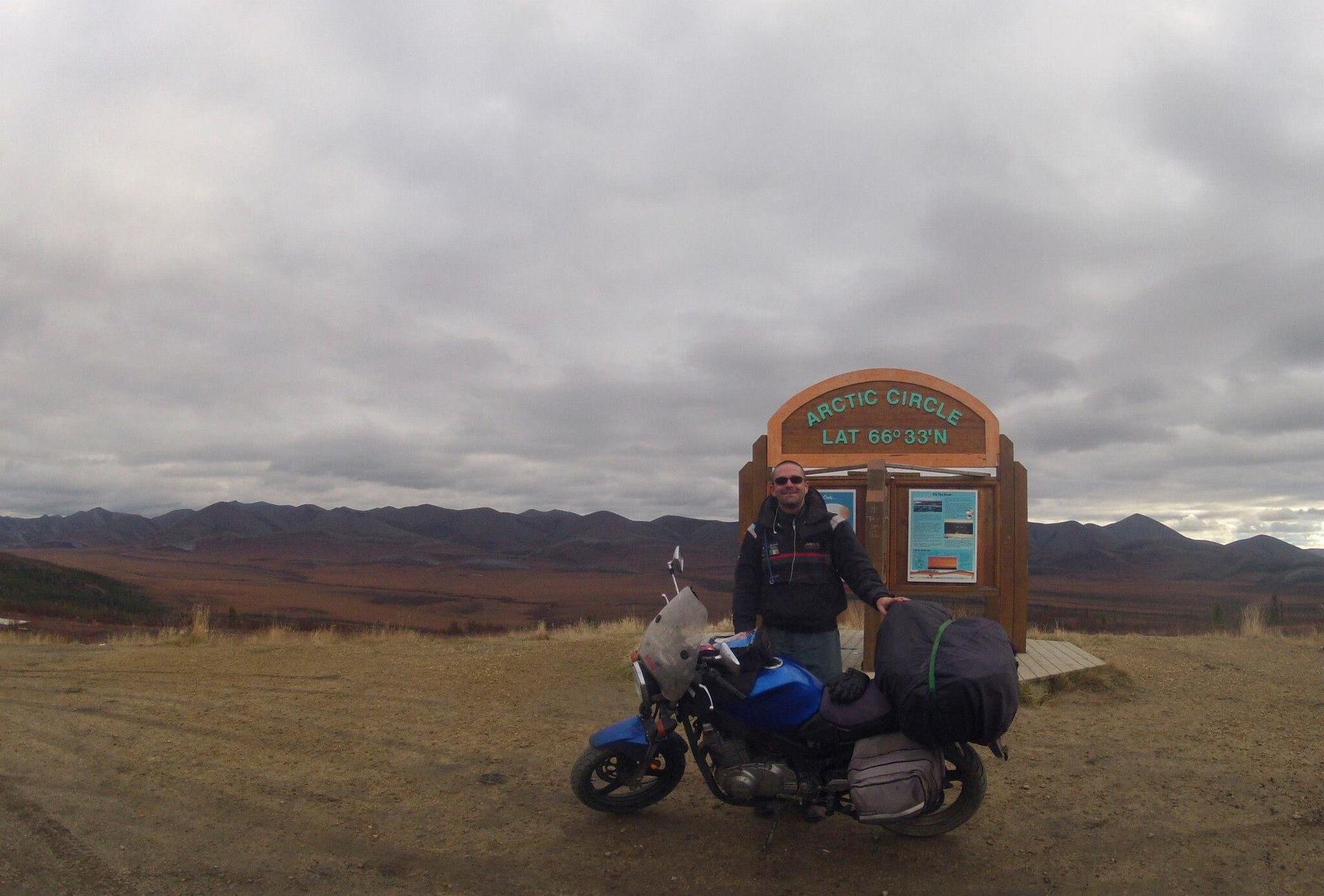 Me and my motorcycle at the arctic circle in the North West Territories, Canada